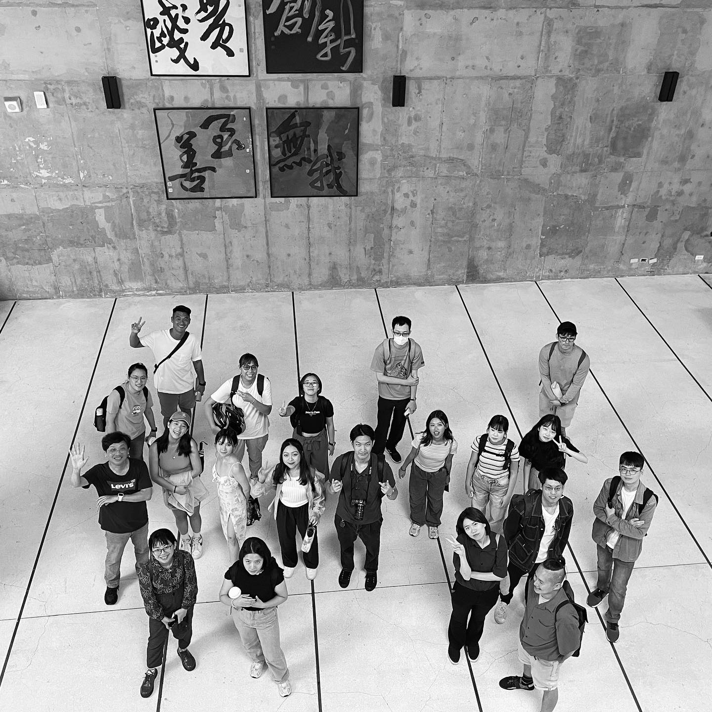 May be a black-and-white image of 18 people and crowd