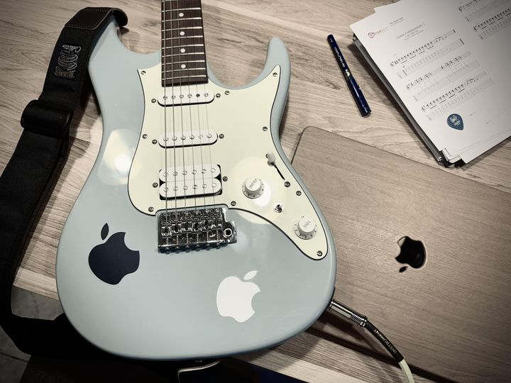 May be an image of guitar and text