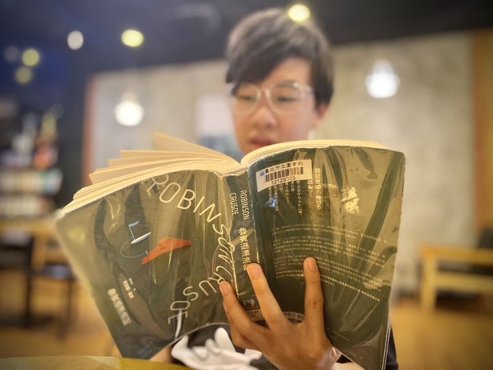 May be an image of 1 person, studying and text