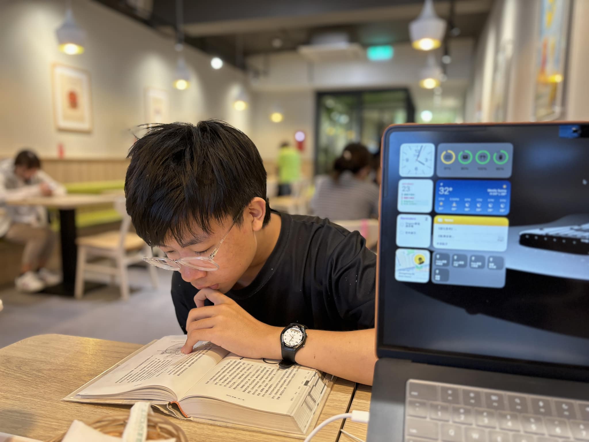 May be an image of 2 people, people studying, phone, childrens toy and text