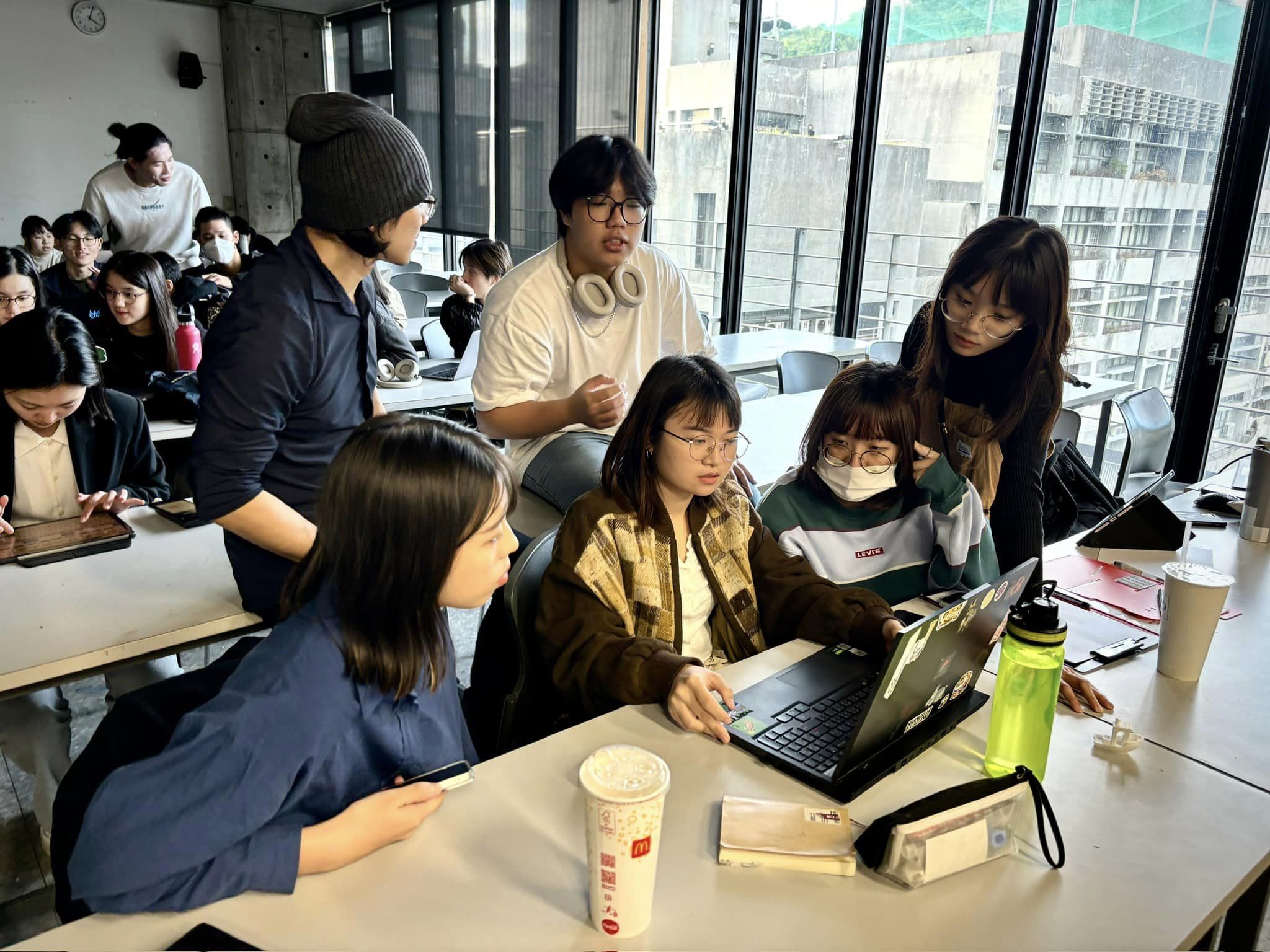 May be an image of 8 people, people studying and text