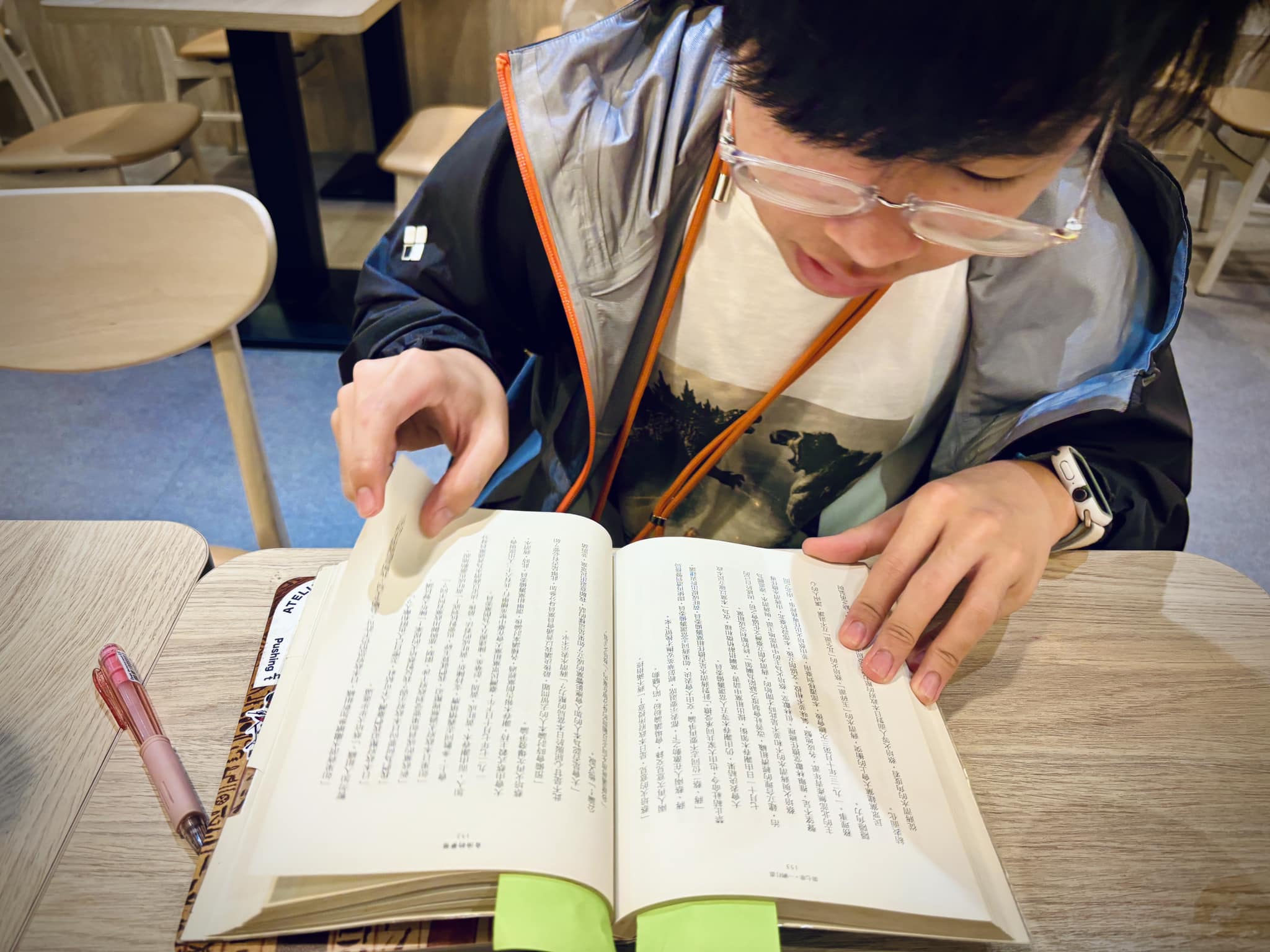 May be an image of 1 person, studying and text